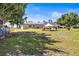 Sprawling grassy backyard featuring a wood deck at 1112 21St E St, Palmetto, FL 34221