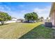 Large backyard with mature trees and a building area at 1112 21St E St, Palmetto, FL 34221