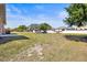 Expansive backyard featuring lush greenery, a building area, and a mix of trees at 1112 21St E St, Palmetto, FL 34221