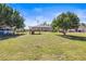 Large grassy backyard featuring a wood deck at 1112 21St E St, Palmetto, FL 34221