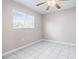 Bedroom featuring tile floors, a ceiling fan and a window with blinds at 1112 21St E St, Palmetto, FL 34221