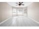 Bedroom featuring tile floors, a ceiling fan and three windows with blinds at 1112 21St E St, Palmetto, FL 34221
