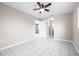 Bedroom featuring tile floors, a ceiling fan and a white door to hallway at 1112 21St E St, Palmetto, FL 34221