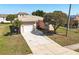 Charming one-story home with a well-manicured front yard, mature landscaping, and a two-car garage at 1112 21St E St, Palmetto, FL 34221