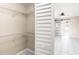 Bright walk-in closet with adjustable shelving and a partial view of a bedroom at 1112 21St E St, Palmetto, FL 34221