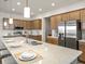 Beautiful kitchen with stainless steel appliances and a large kitchen island at 2432 White Ladyfish Rd, Wimauma, FL 33598