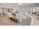Bright living room with contemporary furnishings and an open layout at 2432 White Ladyfish Rd, Wimauma, FL 33598