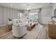 Inviting living room with comfortable seating and access to the outdoors at 2432 White Ladyfish Rd, Wimauma, FL 33598