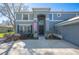 Beautiful gray house with a front lawn and large, tall front entry at 2909 Sutton Oaks Ct, Plant City, FL 33566