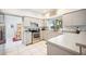 Modern kitchen featuring stainless steel appliances, light countertops, and an undermount sink at 2909 Sutton Oaks Ct, Plant City, FL 33566