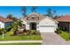 Charming single-story home featuring a stone facade, brick driveway, and well-maintained landscaping at 2932 Sky Blue Cv, Bradenton, FL 34211