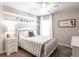 Comfortable bedroom with natural light, stylish furnishings, and calming décor at 6022 Mangrove Creek Rd, Wimauma, FL 33598