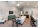 Spacious living room featuring neutral décor, large windows, and an open layout at 6022 Mangrove Creek Rd, Wimauma, FL 33598