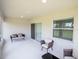 Well-lit patio with comfortable seating and view of the backyard at 6022 Mangrove Creek Rd, Wimauma, FL 33598