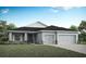 Charming single-Gathering home with well-maintained lawn and an attached two car garage at 6062 Barracuda Loop, Wimauma, FL 33598