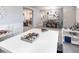 Stylish living room featuring gray walls, carpeted floors, and a dining area at 6062 Barracuda Loop, Wimauma, FL 33598