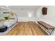 Spacious living room with wood floors, white wainscotting, and a stylish decor at 4208 W Bay Vista Ave, Tampa, FL 33611