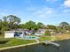 Stunning waterfront property with a private pool, dock, and lush landscaping at 5104 Saint Charles Pl, Tampa, FL 33610