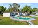 Charming home featuring a refreshing pool, an outdoor patio, and a spacious backyard retreat at 5104 Saint Charles Pl, Tampa, FL 33610