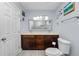 Bathroom featuring double sinks, a large mirror, decorative accents and updated fixtures at 5104 Saint Charles Pl, Tampa, FL 33610