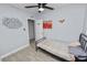 Small bedroom with tiled floors, ceiling fan, and closet at 5104 Saint Charles Pl, Tampa, FL 33610