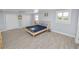 Serene bedroom with light-colored walls, wooden flooring, and double closets at 5104 Saint Charles Pl, Tampa, FL 33610