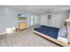 This primary bedroom offers tile flooring, a closet, and views from the window at 5104 Saint Charles Pl, Tampa, FL 33610