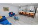 Comfortable living area connected to kitchen and dining featuring a large island with seating at 5104 Saint Charles Pl, Tampa, FL 33610