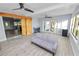 Open living room with barn door, tiled floors, modern lighting, and view to outdoor patio at 5104 Saint Charles Pl, Tampa, FL 33610