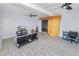 Open living room with tiled floors, TV, barn door, and view to outdoor patio at 5104 Saint Charles Pl, Tampa, FL 33610