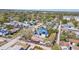 An aerial shot features houses nestled under lush trees, solar panels and well-kept yards in a neighborhood at 923 26Th N St, St Petersburg, FL 33713