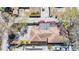 Aerial view of house with red flowers, car, and a yard partially decorated with rocks and mulch at 923 26Th N St, St Petersburg, FL 33713