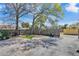 Large backyard offers privacy with wood fencing, grass, and brick paving for versatile outdoor enjoyment at 923 26Th N St, St Petersburg, FL 33713