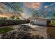 Spacious backyard featuring a detached garage and paved parking area at 923 26Th N St, St Petersburg, FL 33713