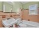 Retro-style bathroom featuring original tile work and classic fixtures at 923 26Th N St, St Petersburg, FL 33713