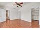Spacious bedroom with wood floors, closet, and ceiling fan at 923 26Th N St, St Petersburg, FL 33713