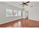 Bedroom with wood floors, ceiling fan, and bright windows at 923 26Th N St, St Petersburg, FL 33713