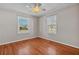 Bright bedroom with hardwood floors, neutral paint, and two windows at 923 26Th N St, St Petersburg, FL 33713