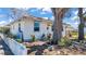 Charming single-story home with manicured landscaping and mature trees in a well-maintained yard at 923 26Th N St, St Petersburg, FL 33713