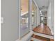 Hallway with hardwood floors and sliding glass doors to the outdoor patio at 923 26Th N St, St Petersburg, FL 33713