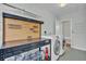 Laundry room includes washer, dryer, utility sink, and storage shelving at 923 26Th N St, St Petersburg, FL 33713