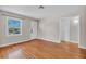 Cozy living room featuring beautiful hardwood floors and a classic front door at 923 26Th N St, St Petersburg, FL 33713