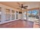 Covered patio with a ceiling fan and double doors leading to the backyard at 923 26Th N St, St Petersburg, FL 33713