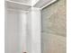 Bright walk-in closet featuring built-in white shelving and storage at 923 26Th N St, St Petersburg, FL 33713