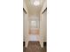 Hallway leading to bathroom with large soaking tub at 10760 S County Road 39, Lithia, FL 33547