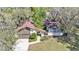 Aerial view of a home showing the roof, driveway, lawn, and surrounding trees at 1316 Cambron Dr, Valrico, FL 33596