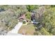 Aerial view of well-maintained home surrounded by a large lot and mature trees at 1316 Cambron Dr, Valrico, FL 33596