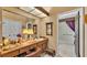 Bathroom vanity area with mirror, dressing table, and shower at 1316 Cambron Dr, Valrico, FL 33596
