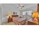 Cozy bedroom features a ceiling fan, large window, and soft lighting for a relaxing atmosphere at 1316 Cambron Dr, Valrico, FL 33596