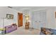 Cozy bedroom featuring closet and a chair with dolls at 1316 Cambron Dr, Valrico, FL 33596